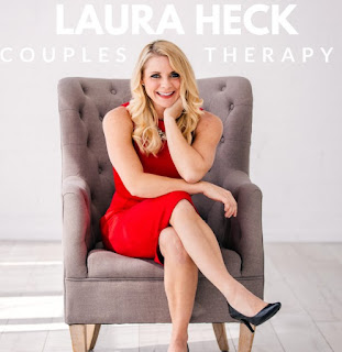 Laura Heck posing for the picture while sitting on the sofa