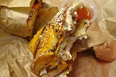 Two Men Bagel House, sesame bagel with non-essential butter, fried egg and hash brown