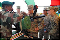 Indian army soilder showing Indian grenade launcher to US soilder