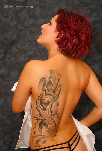 women with back tattoos