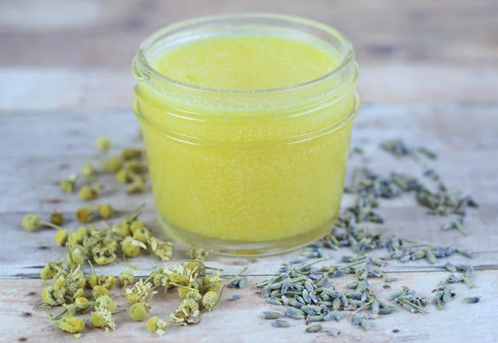 How to make diy after sun balm with calendula and lavender. Use this natural herbal remedies like you would a lotion for sunburn relief.  This homemade salve for skin has coconut oil, shea butter, and aloe vera for skin.  This ater sun salve is a must for summer!  #diy #skincare #herbal #lavender #calendula