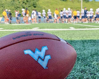 West Virginia University paused all football activities, including workouts and games