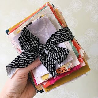 fabric scrap bundle tied up in a bow