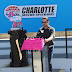 Kurt Busch Joins Cancer Survivors to Paint Pit Wall Pink at CMS