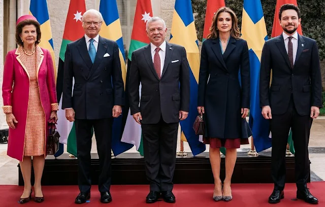 King Carl Gustaf and Queen Silvia, King Abdullah, Queen Rania. Silvia wore a fuchsia coat and houndstooth dress