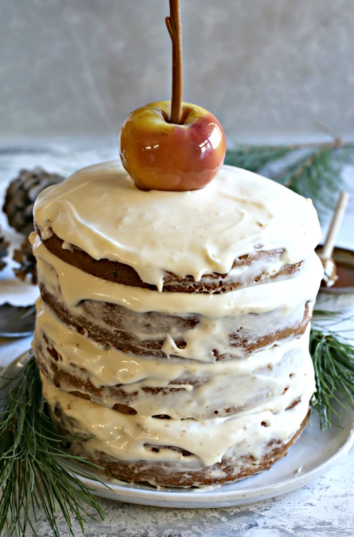 Recipe for a layered honey gingerbread cake, filled with apples and honey cream cheese frosting.