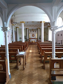 Ornate chapel with white and gold decoration