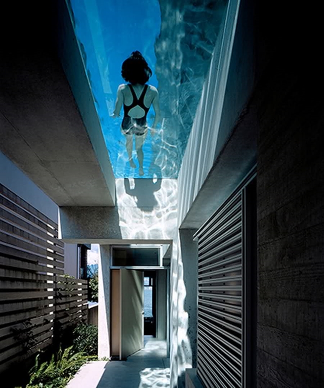 Entrance of modern home with swimming pool above