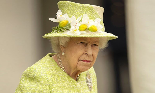 Queen Elizabeth, wearing a lime green coat and the Wattle brooch presented to her on first tour of Australia in 1954
