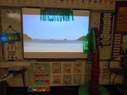 On my SMART Board was a YouTube video of the beach waves and some Caribbean . (sun )