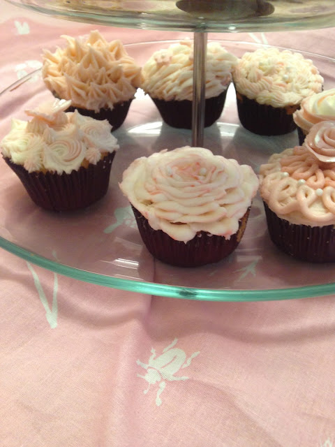 Beautiful assortment of valentine cupcakes in vanilla and buttercream frosting