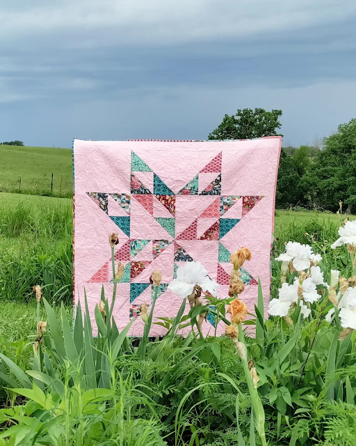 Half-square triangle star baby quilt