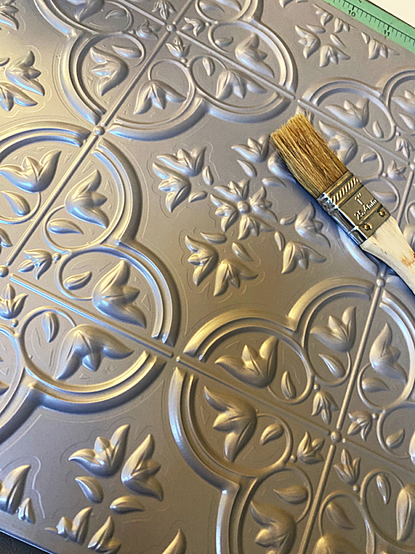 tin ceiling tile and paint brush