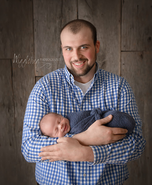 Newborn Baby Boy and Daddy in the DeKalb IL photography studio of Wigglebug Photography 