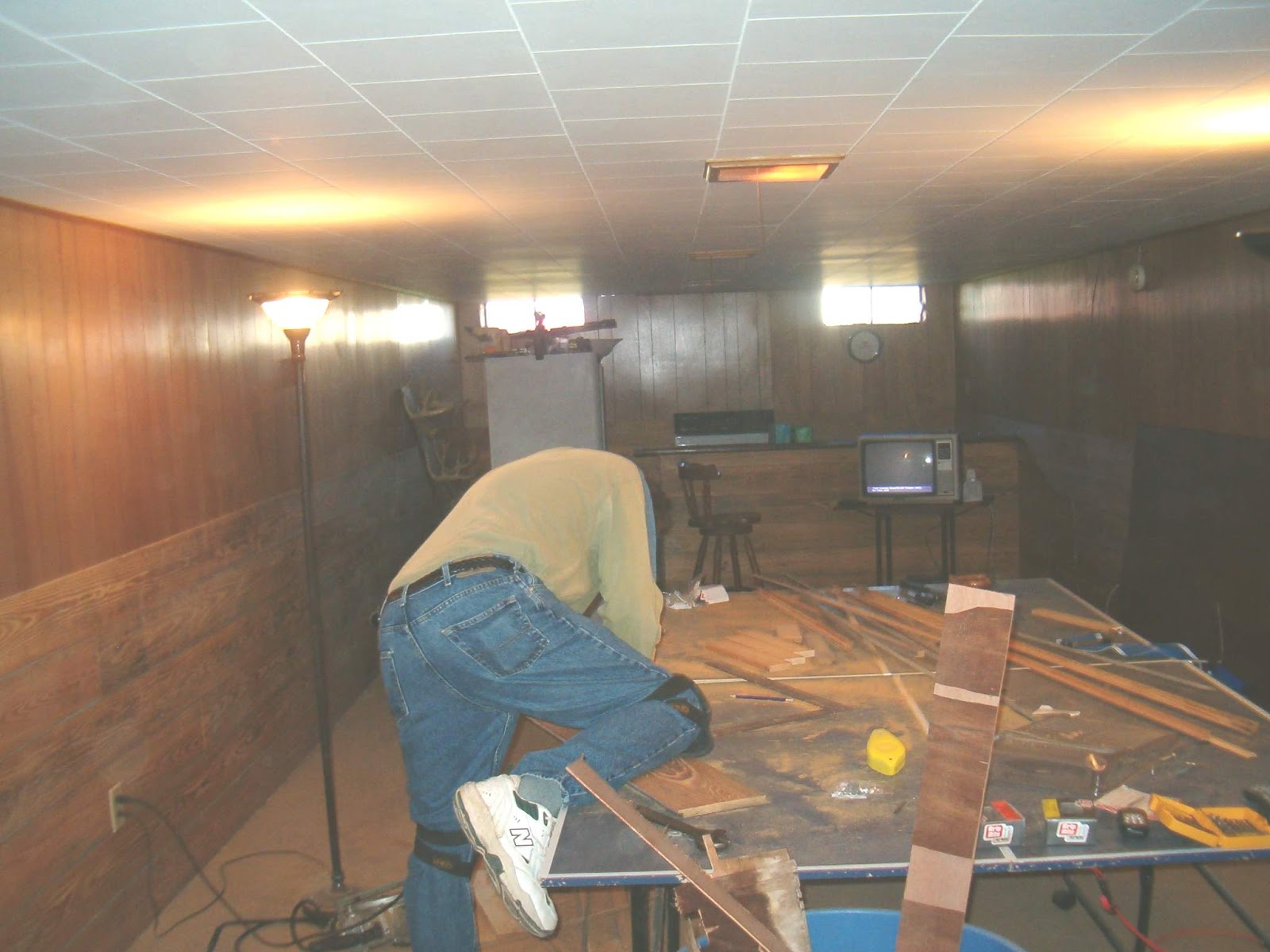 We decided to cover the bottom half of the paneling with barn wood.
