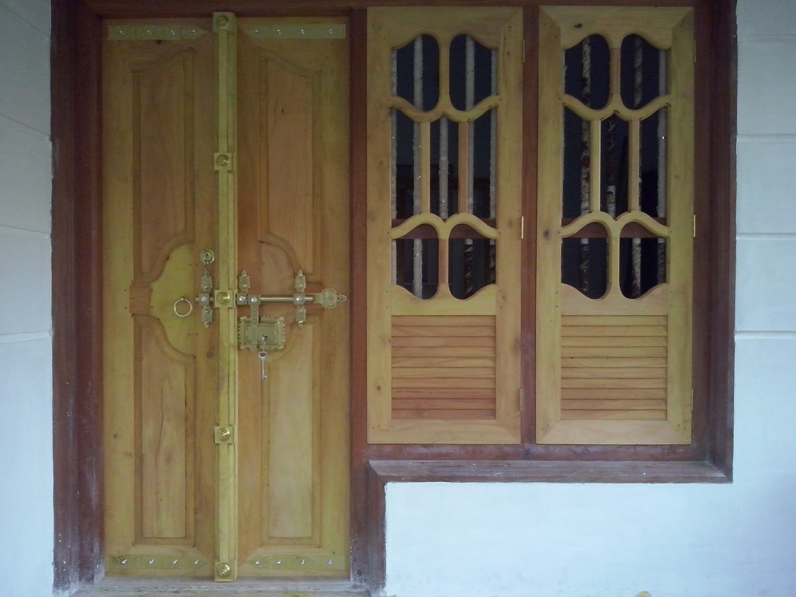 kerala style Carpenter works and designs: front entrance wooden doors 