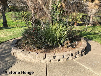 A Stone Henge and Mimosa Tree - Made out of Concrete - Unless someone Picks Up the Concrete Blocks and Moves them to another location - this Henge will be here Ten Thousand Years from Now - gvan42