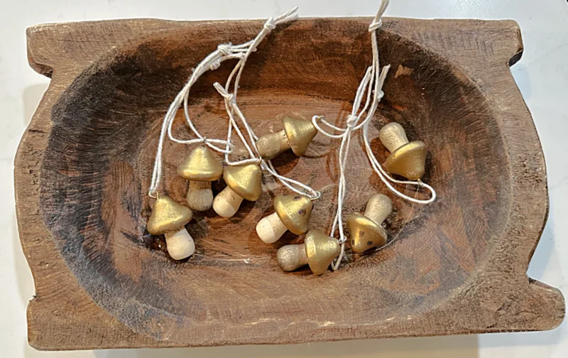 wooden bowl of mini mushroom ornaments