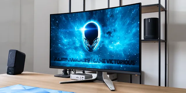 An image of the Alienware AW3225QF monitor in top of a wooden desk