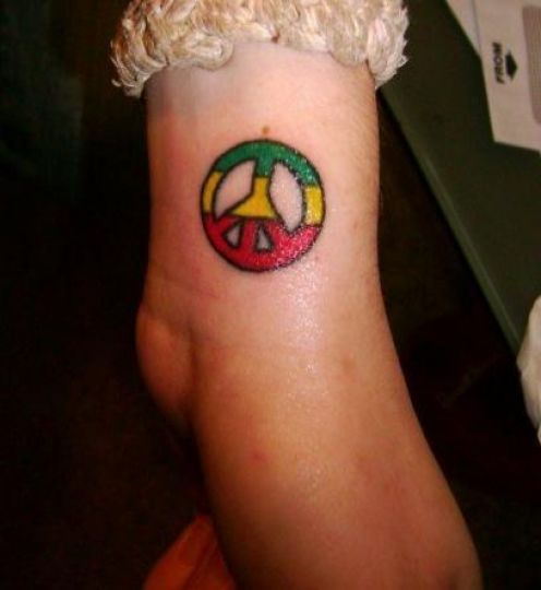 peace sign tattoos on wrist