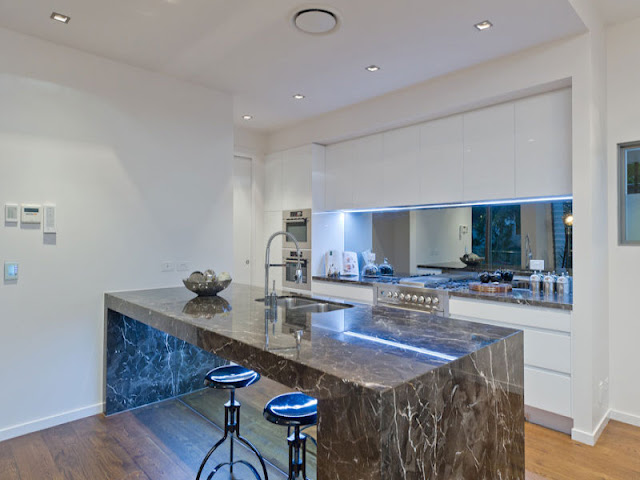 Photo of modern dark marble kitchen island in the kitchen of contemporary modern home in Brisbane