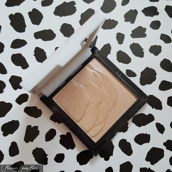 open compact of highlighting powder from No7 limited edition release in 2012