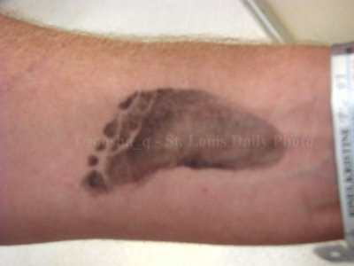 baby footprints tattoo. Baby footprints tattooed on