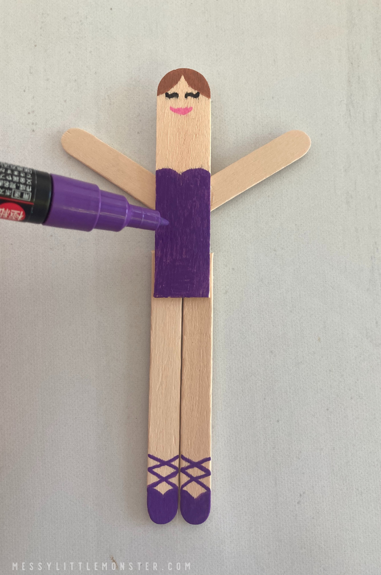 draw details on popsicle stick ballerina dancer craft