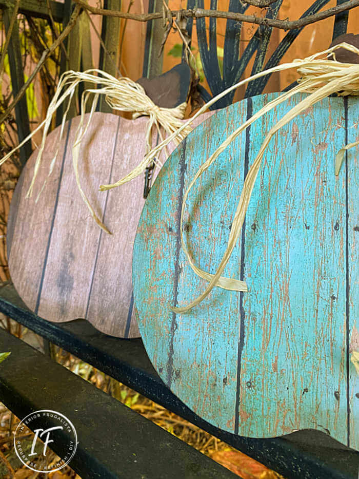 These rustic faux reclaimed wood pumpkins look just like the real thing but they are made with dollar store pumpkin shapes and decoupage paper.