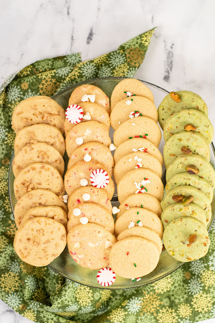 christmas cookies lined up on a platter.