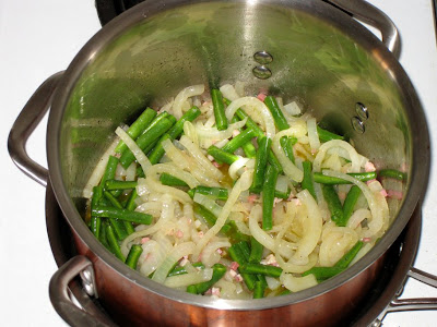 Toss in string beans once onions have almost dissolved