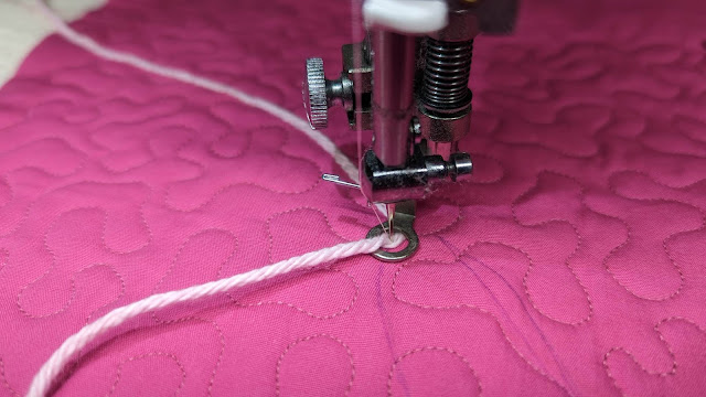 Yarn couching with a free-motion foot on a Juki sewing machine