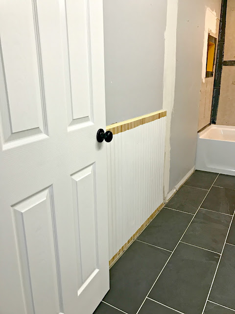 Beadboard walls in bathroom 