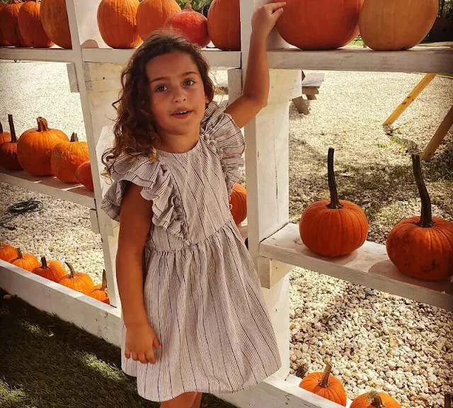 Princess Adrienne wore a pompom detail layered butterfly sleeve striped dress by Kidenhouse. Princess Leonore