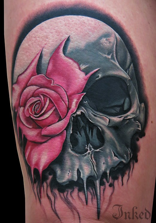 Grey skull with pink rose tattoo