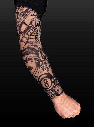 An BIOMECH arm tattoo on the whole left arm (except the part where the anbu