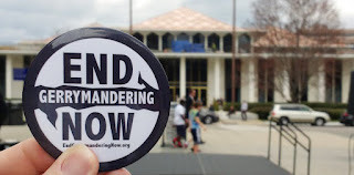 NC General Assembly building with close up of End Gerrymandering Now button