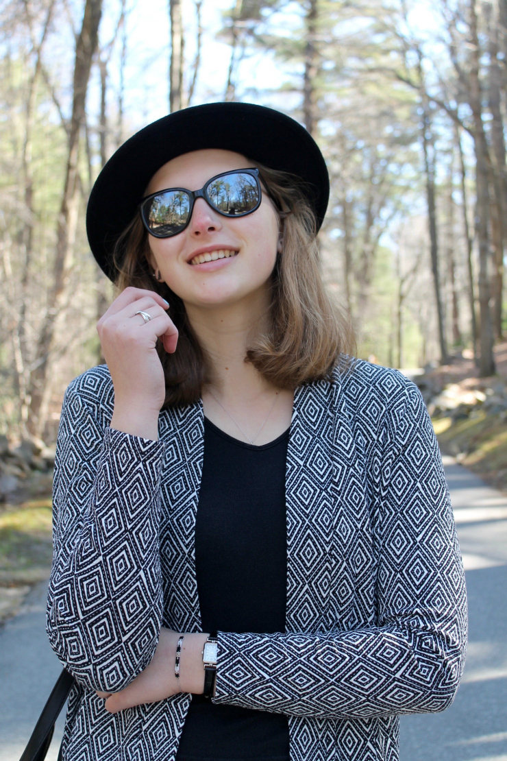 Chic black and white outfit [H&M black and white printed vest, black crop top, elegant black bag and leather slip on sneakers]