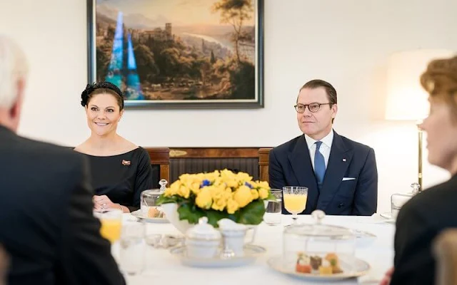 Crown Princess Victoria wore a new navy blue dezire wool coat by Andiata, and black dress by Andiata. Elke Büdenbender