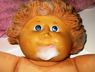 Cabbage Patch Kid doll getting hair shampooed wearing soapy beard