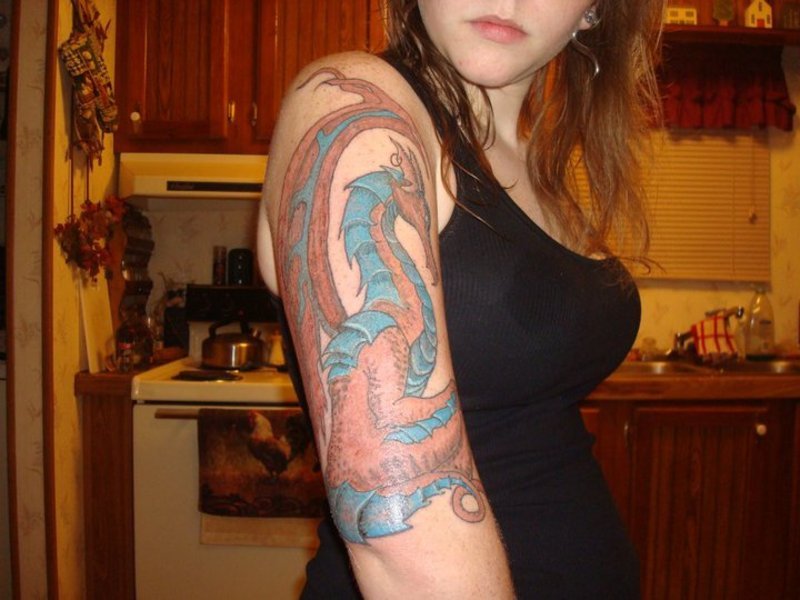 Dragon upper arm tattoo for women
