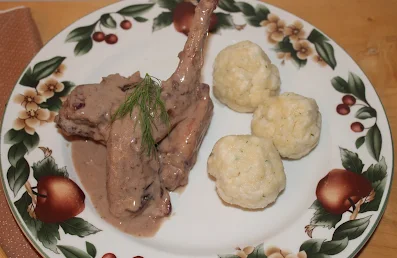 Serving plate with Hasenpfeffer and dill dumplings.