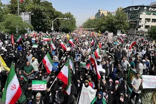 Mass demonstrations in Iran condemning Israeli attacks and in support of the regime