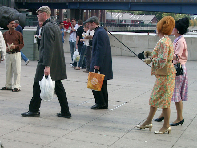 Husbands on a leash, Reuters Plaza, Canary Wharf, London