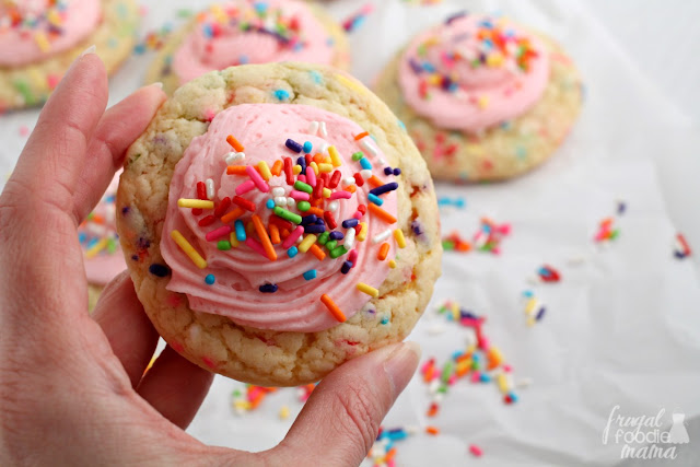 Soft & thick cake mix cookies are loaded up with rainbow sprinkles & then topped with a perfect buttercream frosting in these Rainbow Sprinkle-fetti Cookies.