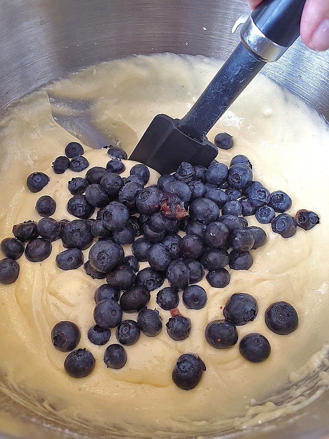 folding blueberries into the batter