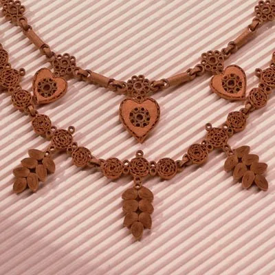 ornate quilled necklace made of cardboard