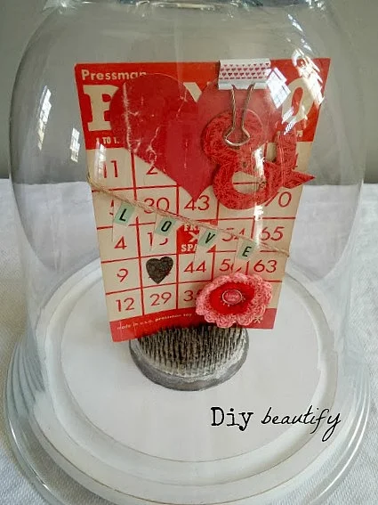 Display vintage Bingo card and other ephemera in a glass cloche for a sweet display! Find more at diy beautify!