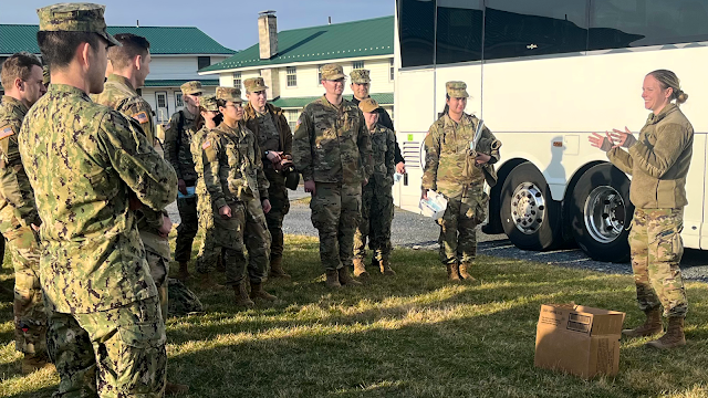 Army Maj. (Dr.) Laura Tilley debriefs the SOM Class of 2023 students at the Operation Gunpowder field exercise. [Photo credit: Army Maj. (Dr.) Laura Tilley, USU]