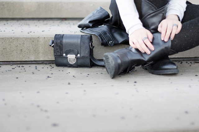 black mini bag and biker boots